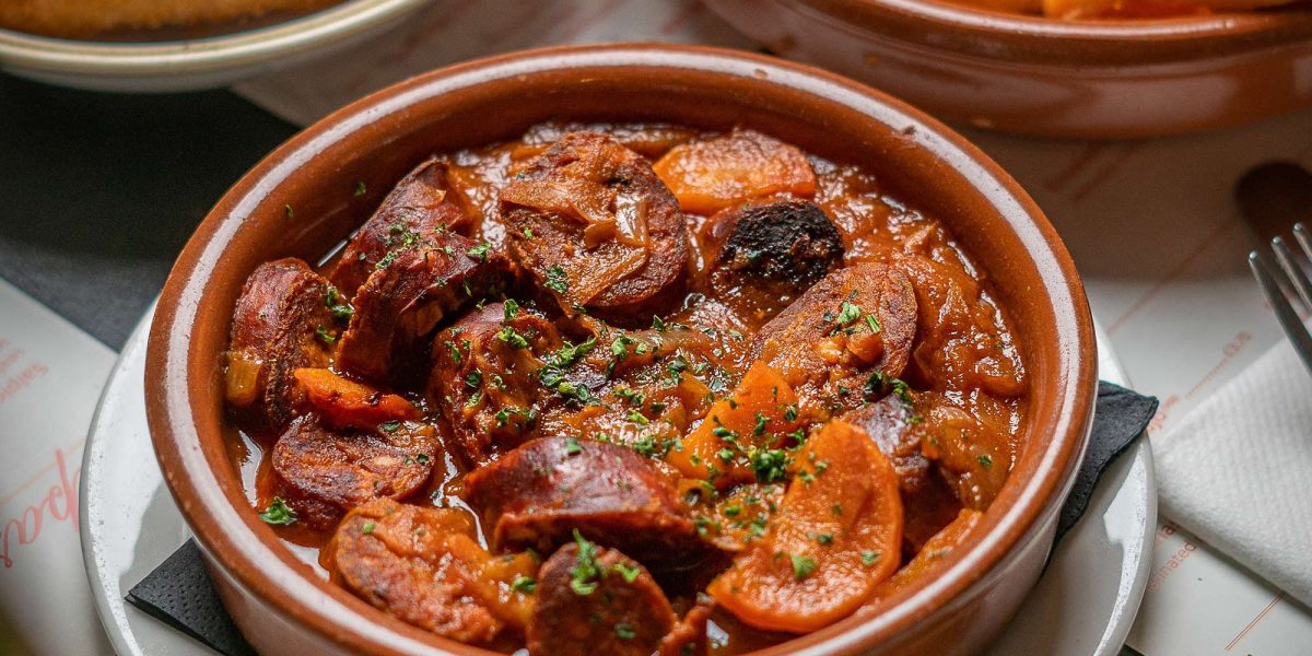 Tasting Spicy Chorizo at Restaurant Mayfair Best Spanish Tapas Bar London