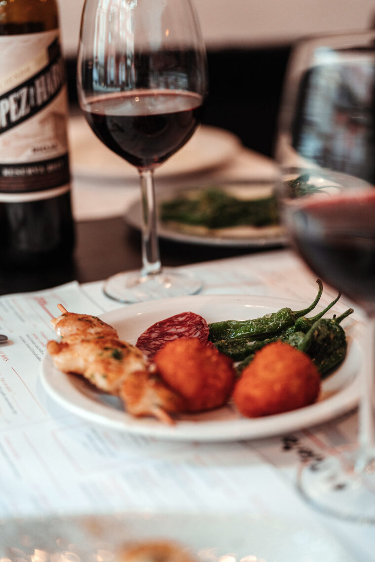Glass of Lopez Rioja Spanish red wine from Northern region served with Tapas