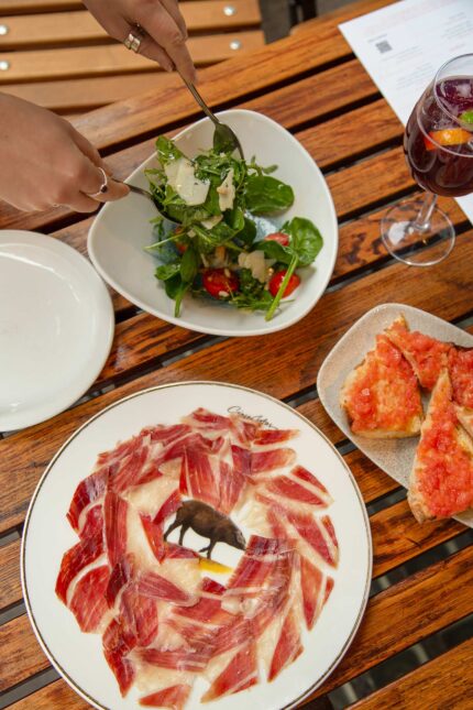 Mediterranean diet green salad dining al fresco in Mayfair tapas wine bar