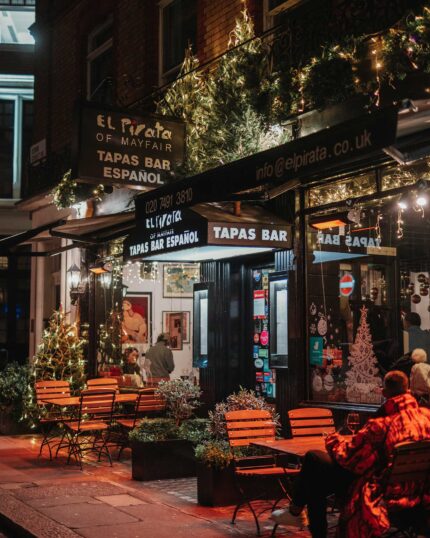 Festive Christmas atmosphere at El Pirata Spanish tapas bar in Mayfair London with holiday lighting and drinks