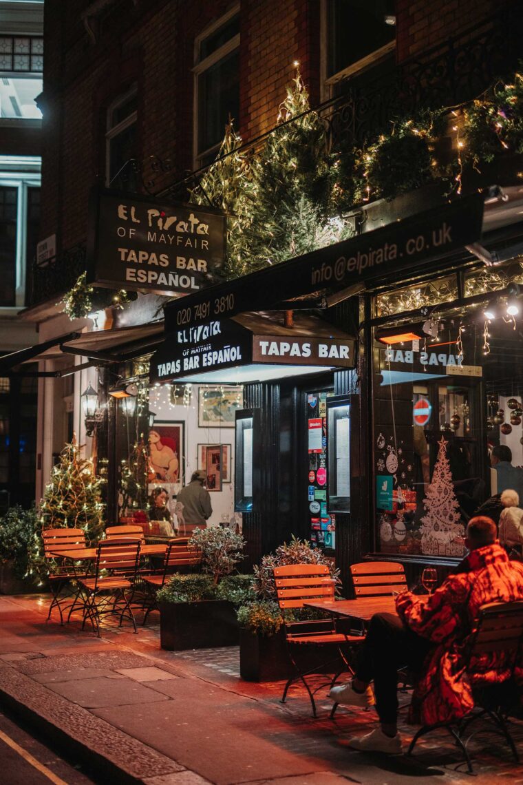 Festive Christmas atmosphere at El Pirata Spanish tapas bar in Mayfair London with holiday lighting and drinks