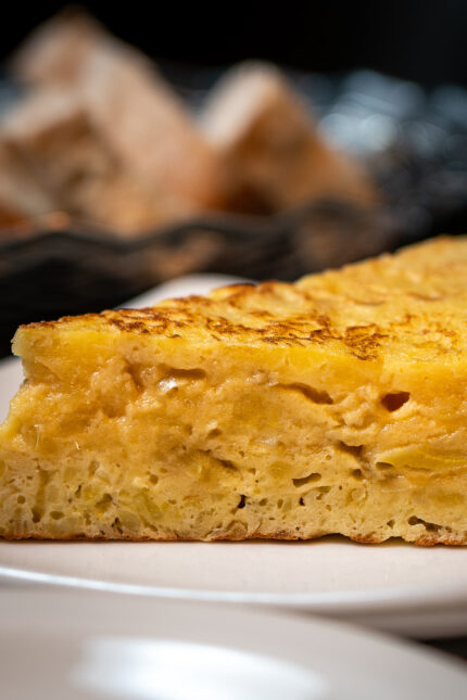 Freshly prepared slice of Spanish tortilla tapas small plate dish