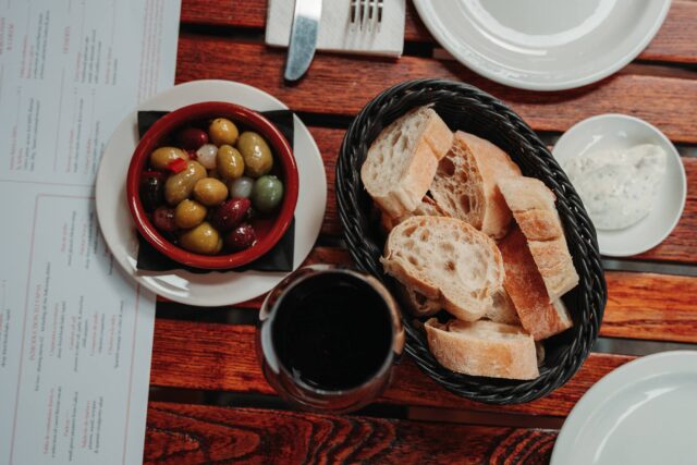 Spanish sherries Glass of Spanish red wine bread pan olives table outside our Tapas bar