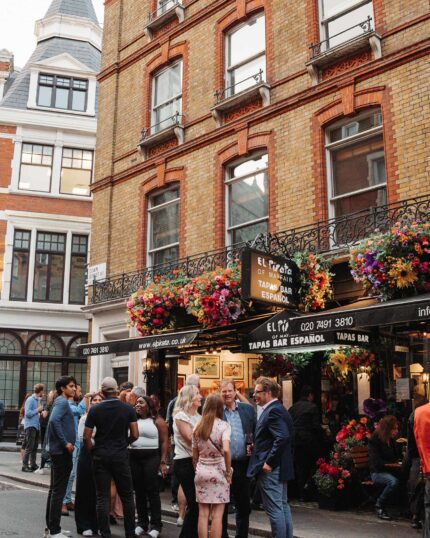 Group gathering outside tapas bar drinks party menus