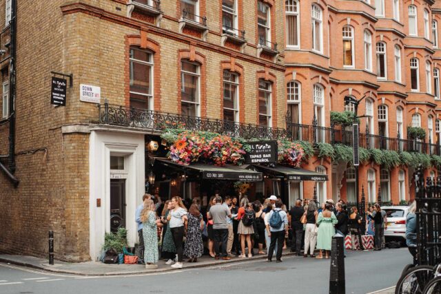 Group party standing reception wine tapas bar Mayfair London