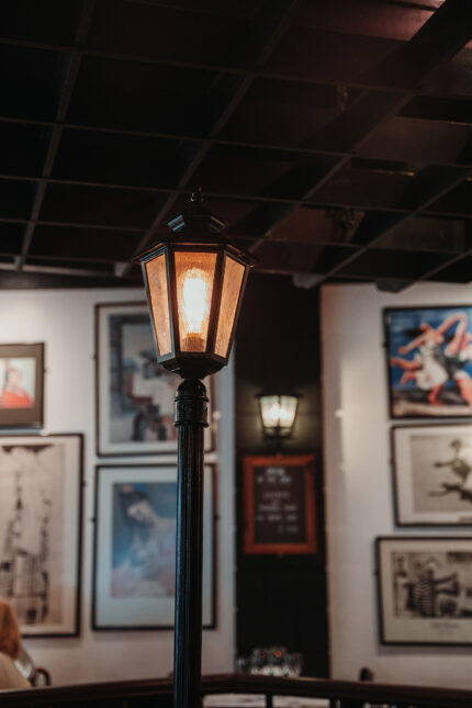 Cozy dining room at El Pirata Mayfair with iconic lampost set up for group Christmas parties in central London