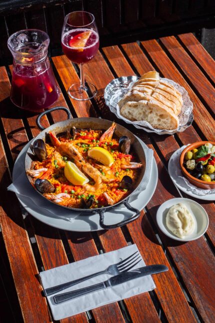 Paella served with sangria in London freshly prepared traditional way