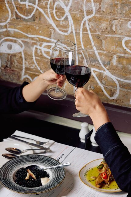 Premium Red Spanish wines couple toasting friendship at Mayfair restaurant
