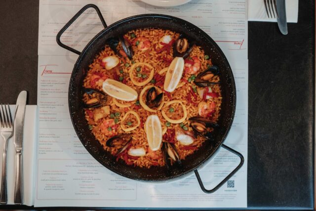 Seafood paella in cast iron pan traditional classic Spanish dish