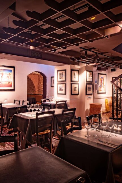 The Secret Cellar dining room set with tables and chairs for a private event.