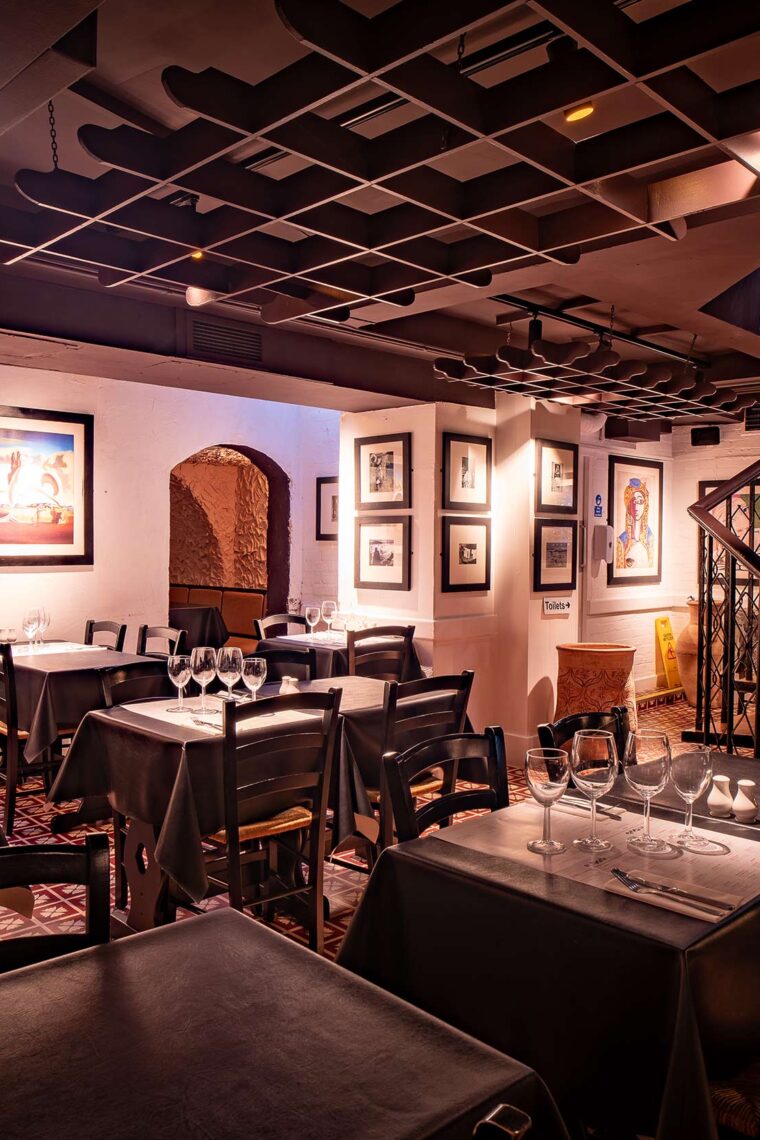 The Secret Cellar dining room set with tables and chairs for a private event.