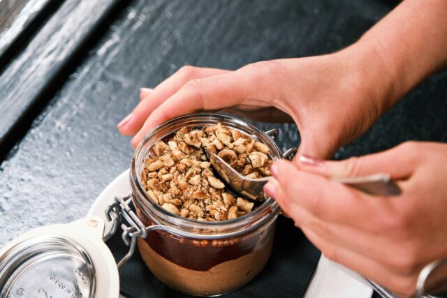 Decadent chocolate mousse with raspberry compote and chopped hazelnuts served at El Pirata Tapas Bar in Mayfair, London