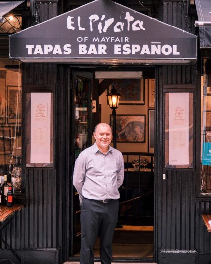 Attentive staff serving customers at El Pirata Mayfair, friendly Spanish tapas dining experience