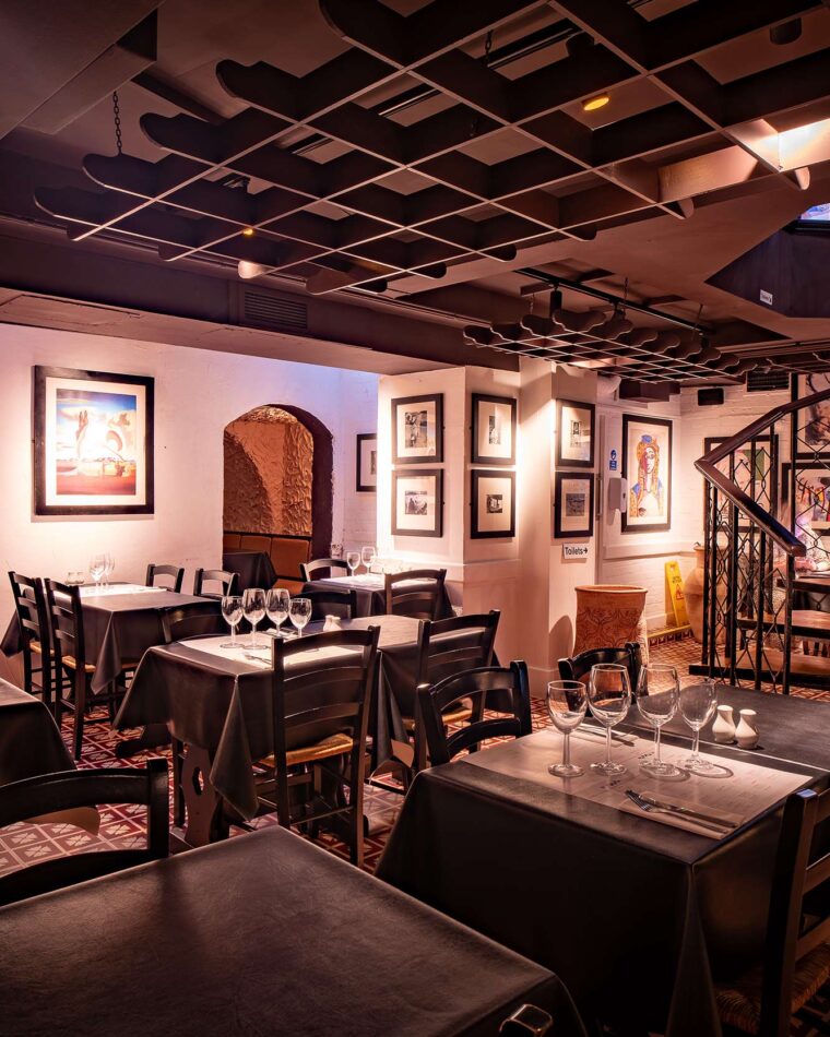 Tapas bar restaurant wine cellars dining tables stairs