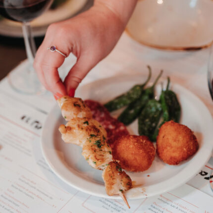 Tapas chicken skewers small plate dishes at the bar