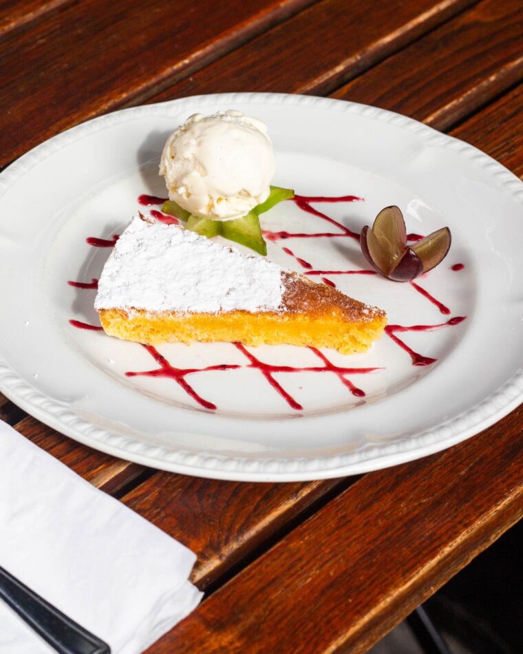 Tarta de Santiago at Spanish Restaurant Bar in London Mayfair, made from ground almonds, eggs and sugar with lemon zest, sweet wine, brandy.